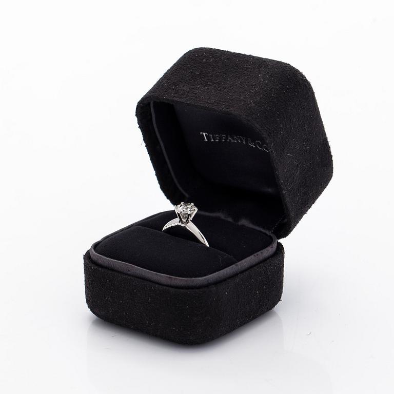 Tiffany & Co, a platinu solitaire ring with a brilliant-cut diamond.
