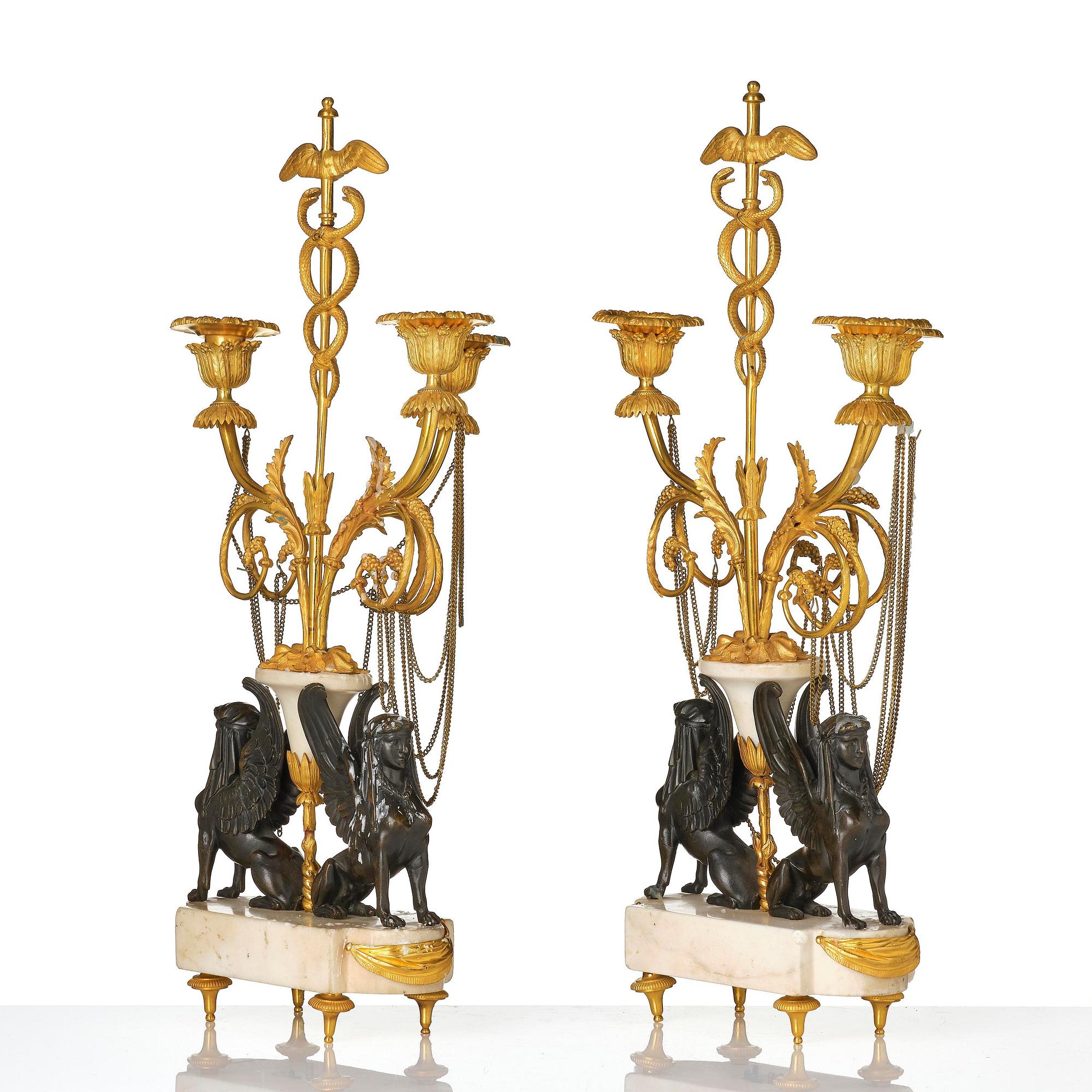 A pair of Louis XVI three lights Candelabra, Parisian works, in the manner of François Rémond, late 18th century.