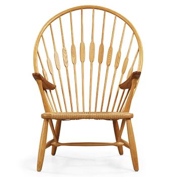 87. A Hans J Wegner ash and teak 'Peacock chair' by Johannes Hansen, Denmark.