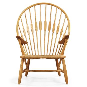 A Hans J Wegner ash and teak 'Peacock chair' by Johannes Hansen, Denmark.