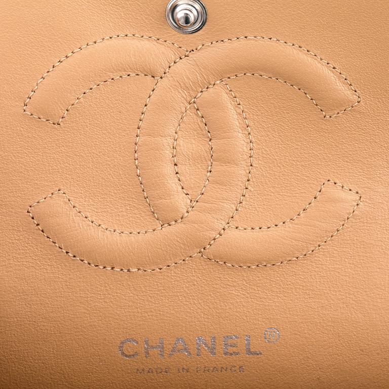 CHANEL, a beige caviar leather "double flap" shoulder bag.