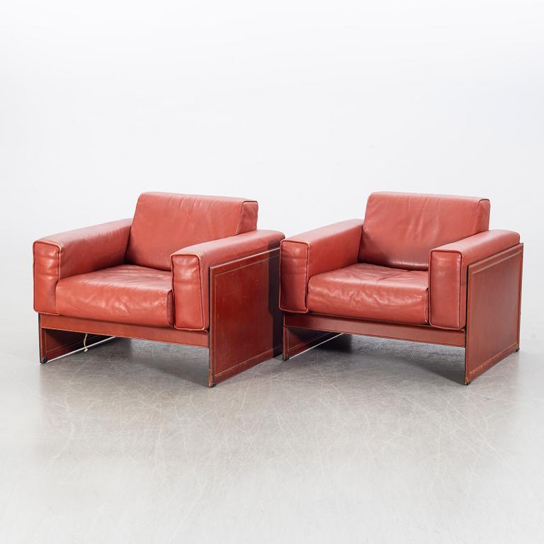 A pair of armchairs by Tito Agnioli for Matteo Grassi, second hal of the 20th century.