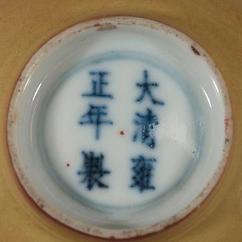 A pair of Imperial yellow bowls, Qing dynasty, Yongzheng six-character mark and of the period (1723-1735).