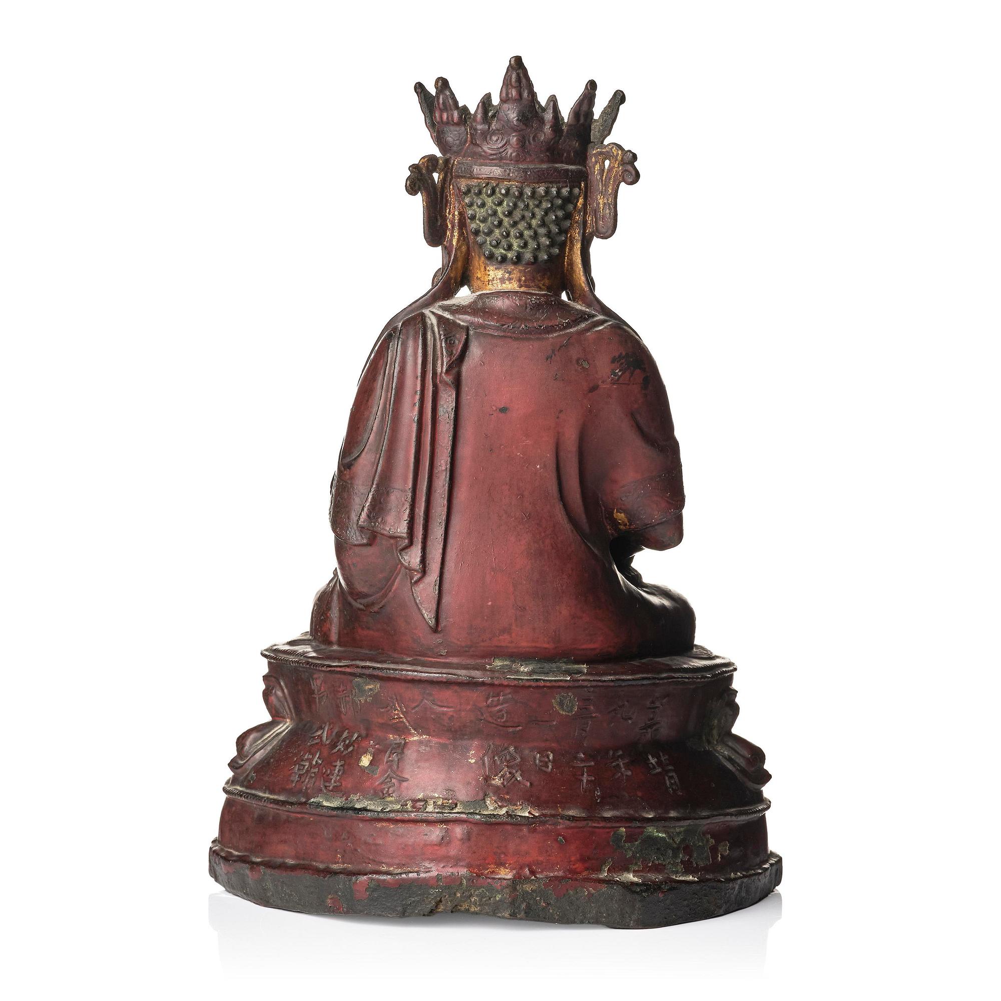 A bronze sculpture of a crowned Buddha, presumably late Ming dynasty, with an inscription dating it as 1530.