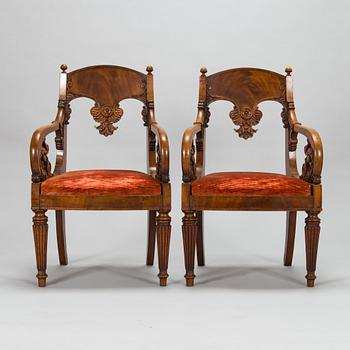 A pair of Baltic open armchairs from around 1820.