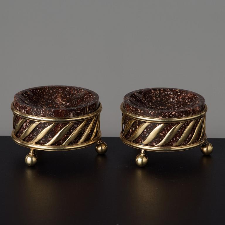 A pair of gilt silver and porphyry salts, by Gustaf Folcker, Stockholm 1827.