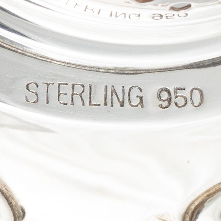 Two sterling silver tea strainers with stands, 20th century.