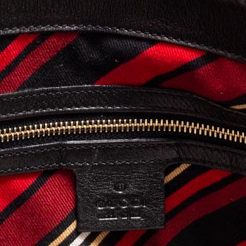 GUCCI, a leather hand bag.