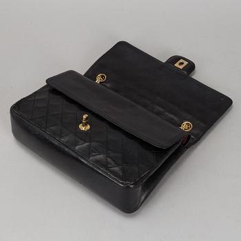 CHANEL, a quilted black leather 'Double Flap Bag'.