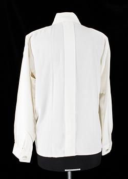 A set of two silk blouses by Yves Saint Laurent.