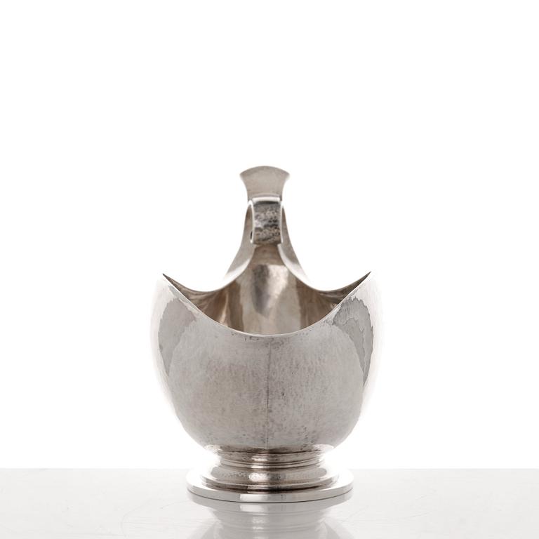 Georg Jensen, a sterling silver sauceboat and ladle, Copenhagen 1925-1945, design nr 98 and 141.