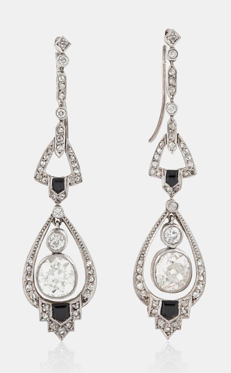 A pair of old-cut diamond and onyx earrings. Total carat weight circa 4.70 cts.