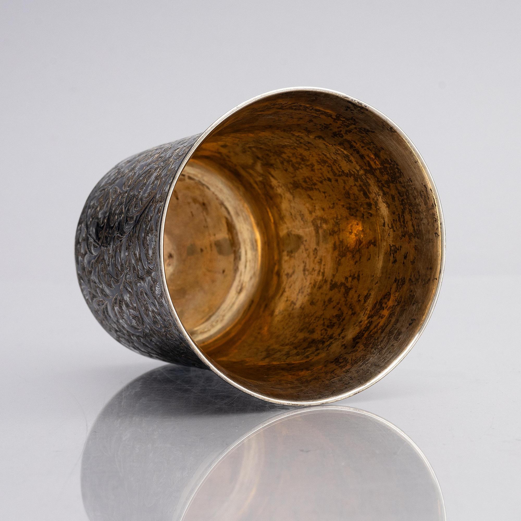 A Russian silver-gilt beaker with niello, unidentified maker A.K., assay master Michael Chumazov, Moscow 1846.