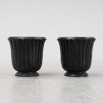 A pair of cast iron urns by  Bengt Wallde for Näfveqvarn, designed around 1935.