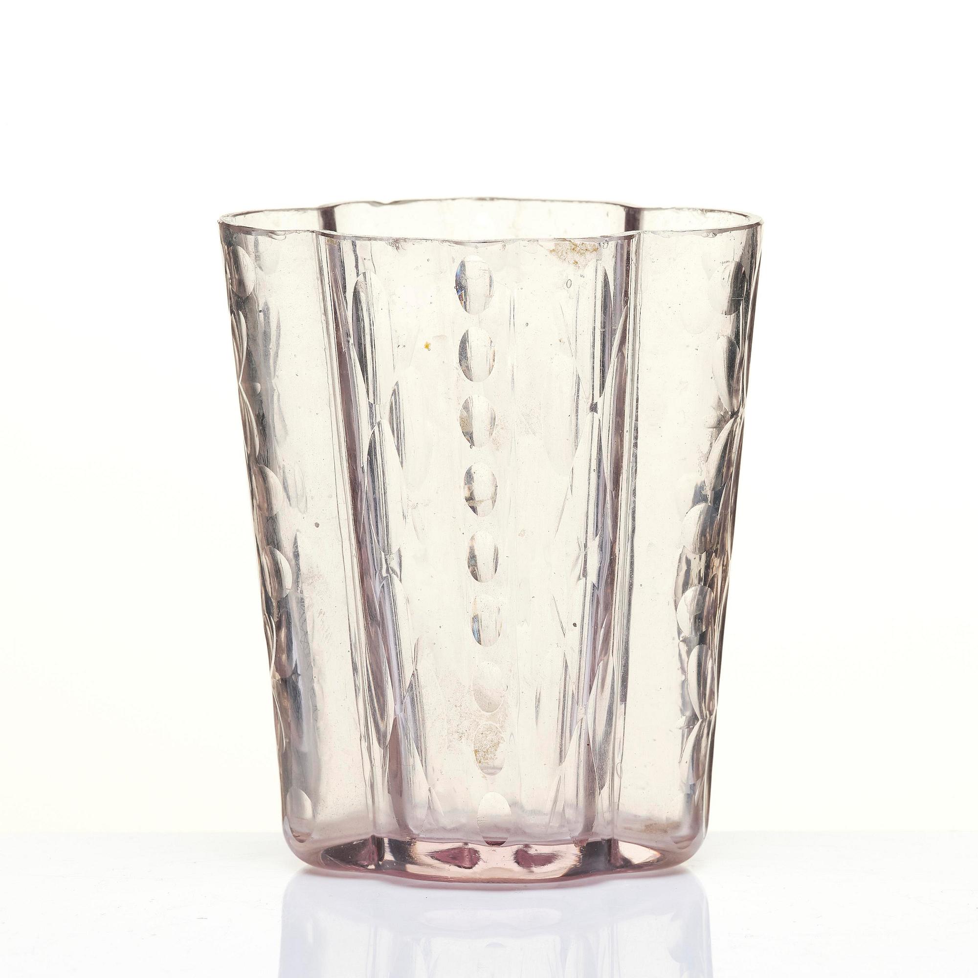 An amethyst coloured suger shaker and a cut glass goblet, 18th century.