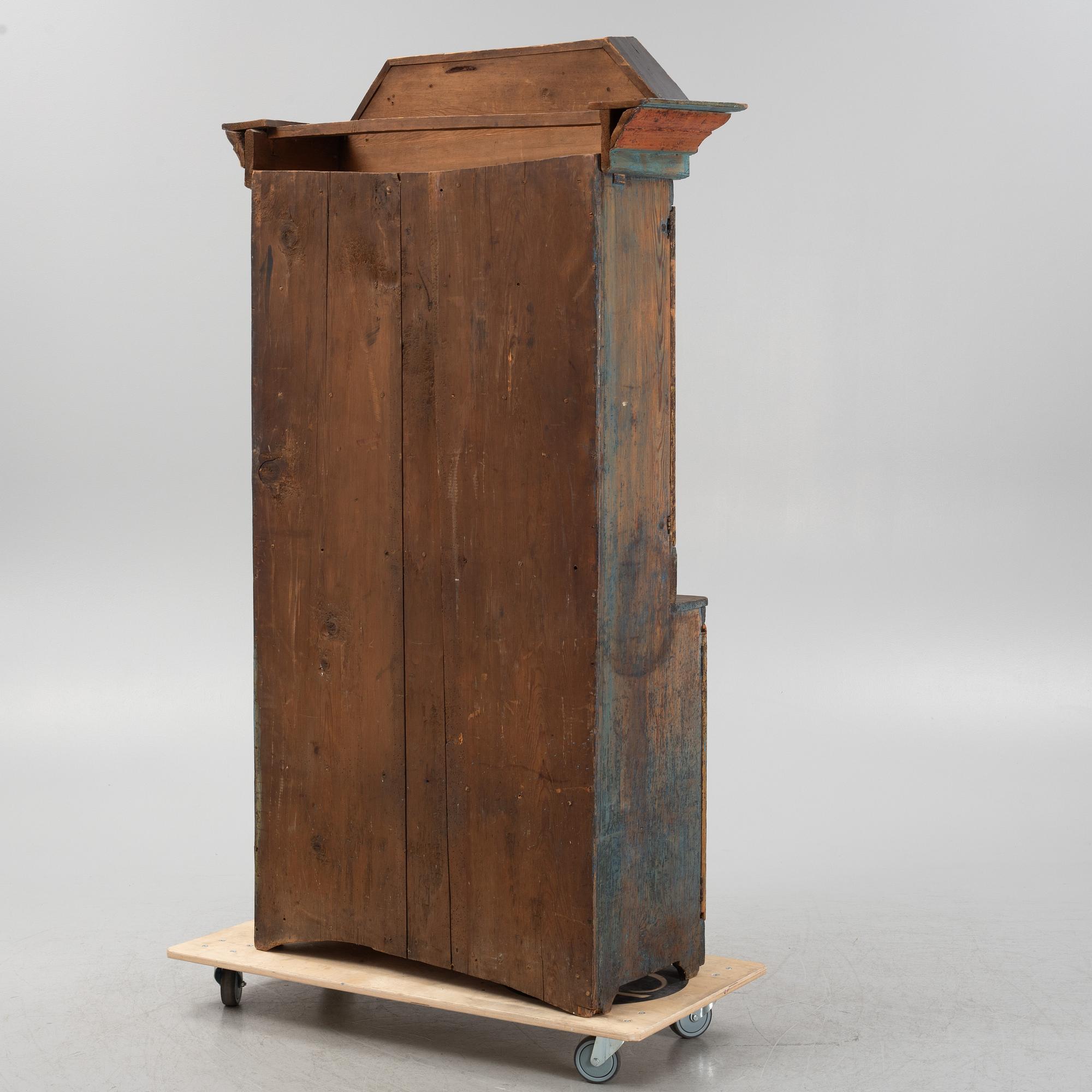 A painted cabinet, dated 1825.