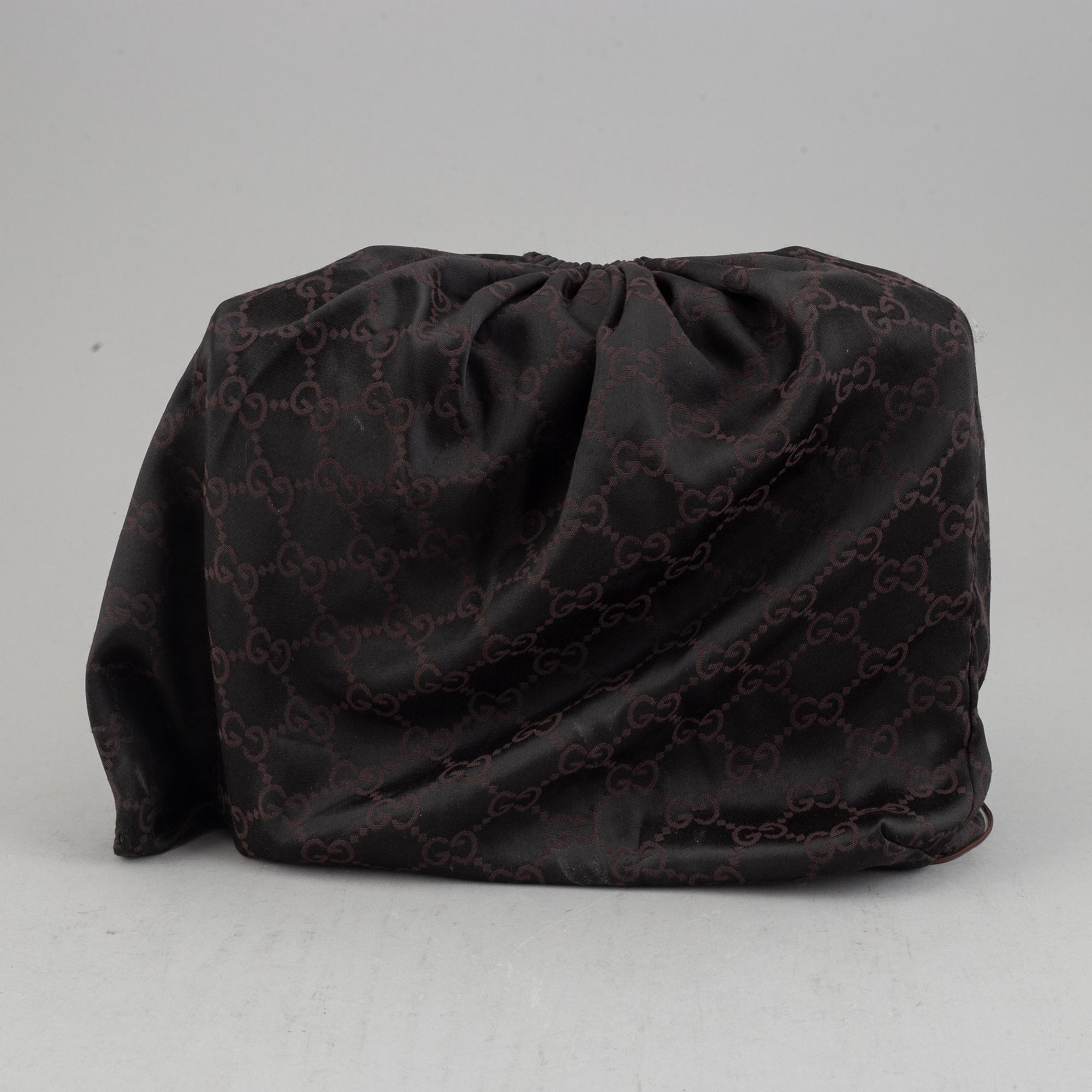 Gucci, a leather and bamboo bag.