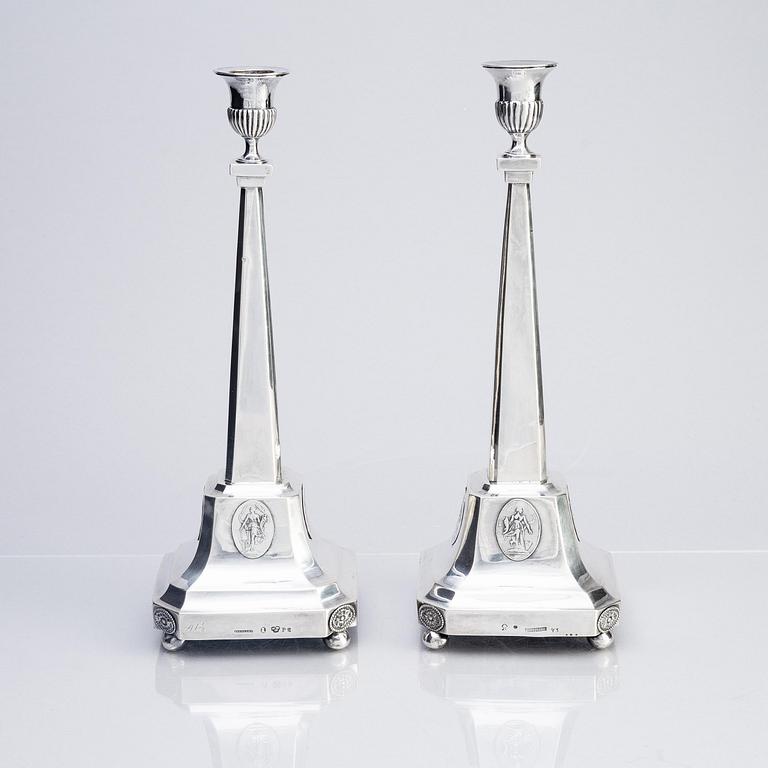 A pair of Swedish silver candelabras, marks of Pehr Zethelius, Stockholm 1797 and Daniel Hedberg, Eksjö 1829.