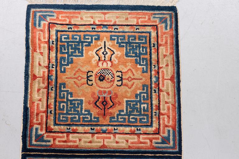 A semi antique chinese meditation rug, ca 159,5 x 57 cm.