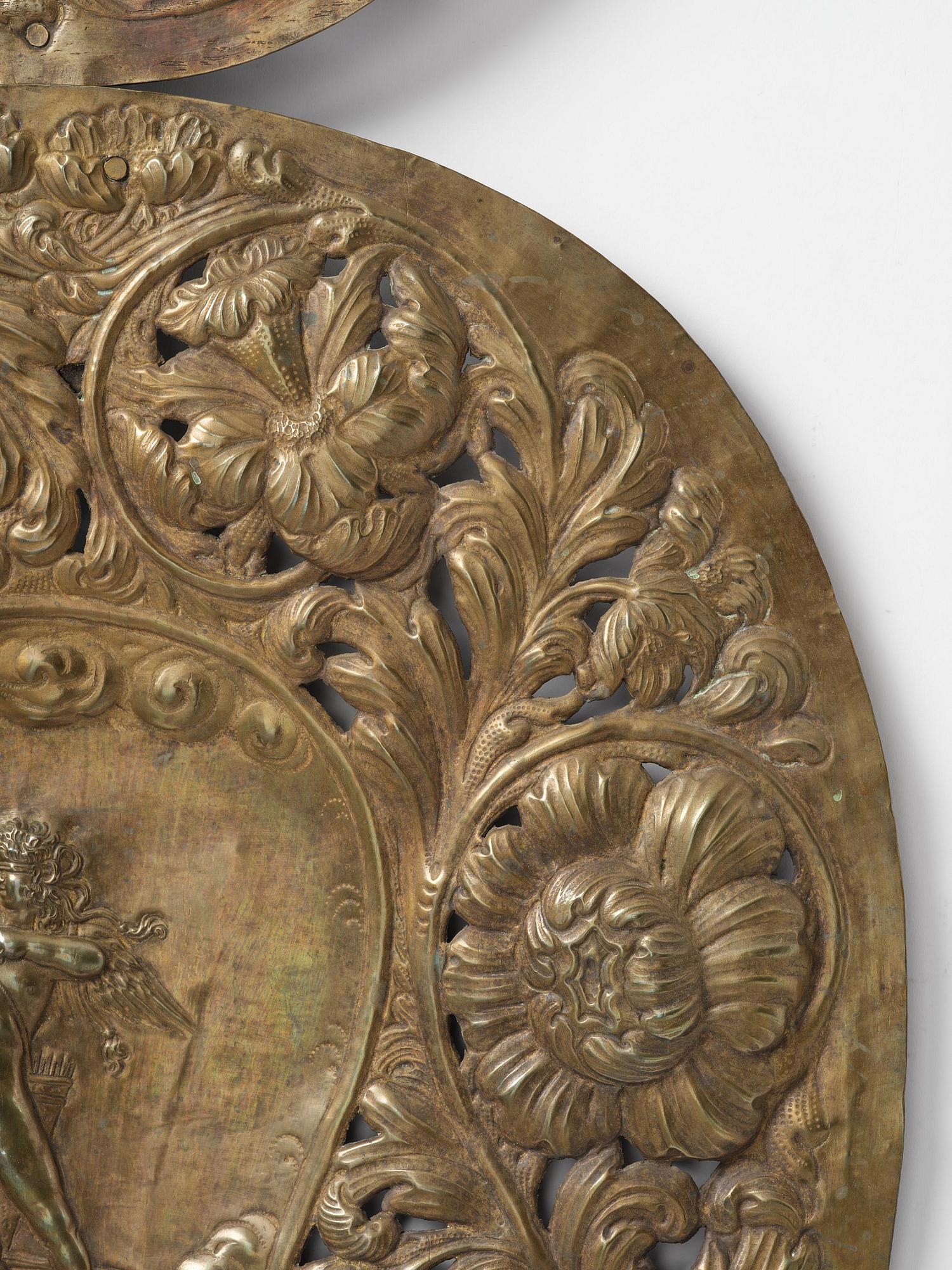 A set of four Swedish Baroque repoussé silvered brass reflector one-branch reflector plates, ca 1690-1700.