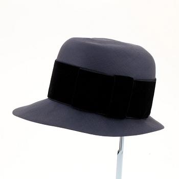CHANEL, a navy blue hat.