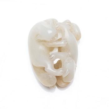 A nephrite figure of two mythical creatures, China, early 20th Century.