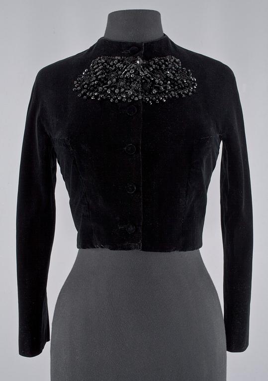 A black velvet evening jacket with pearls by Carnegie.