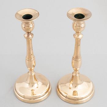 Skultuna Messinsbruk, two pairs of brass candlesticks, 19th century.