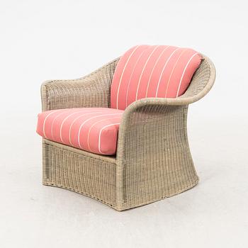 A Bonacina special edition rattan armchair 21st  century.