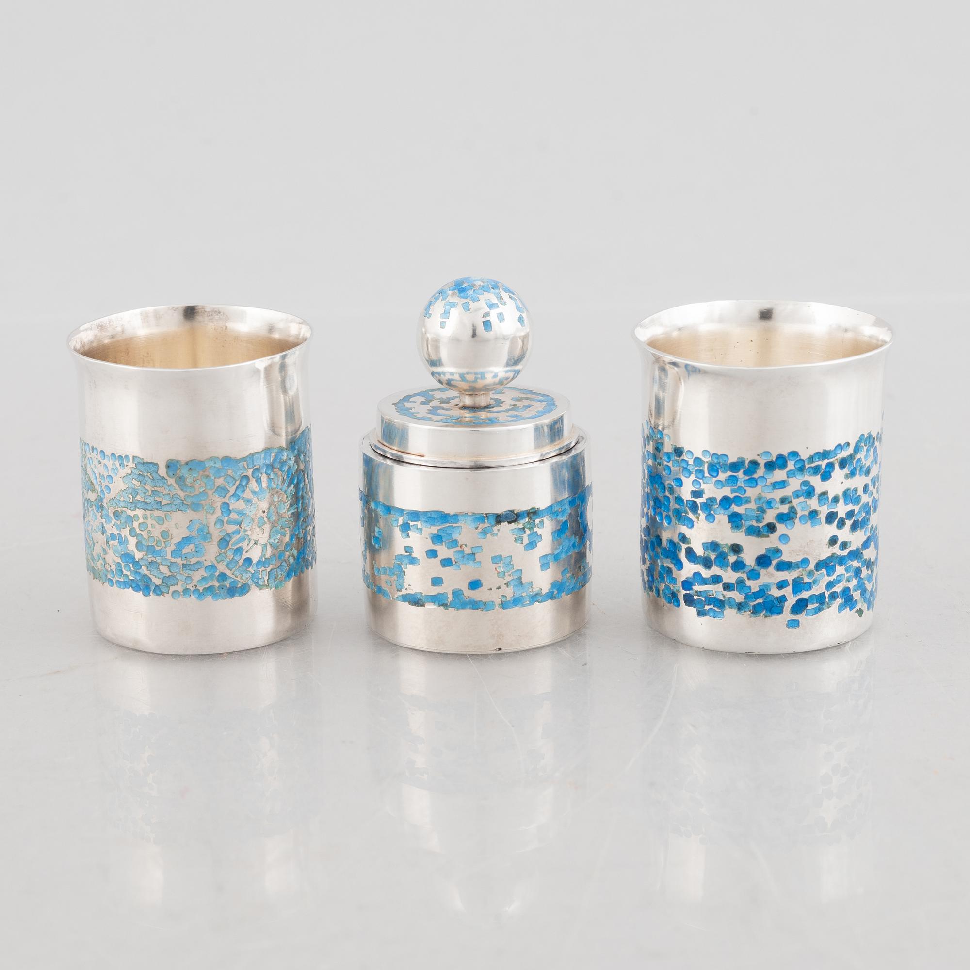 Two sterling silver and enamel miniature beakers and a small box with lid, marks of Lars Arby, Gothenburg, Sweden.