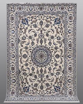 A carpet Nain, part silk, ca 290 x 196 cm.