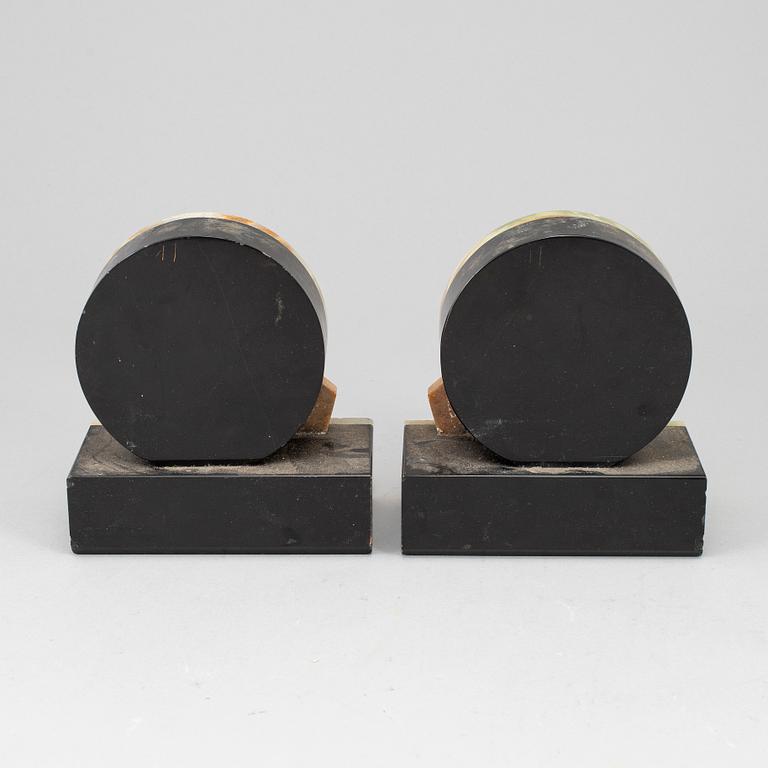 A pair of art déco onyx and marble book ends, 1930s.