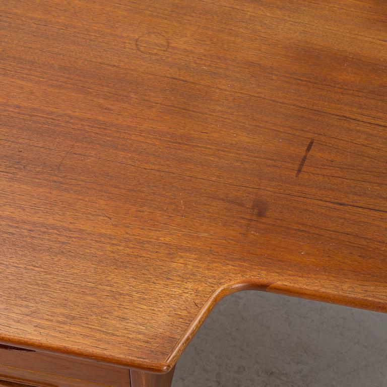 A teak veneered desk, 1950's/60's.