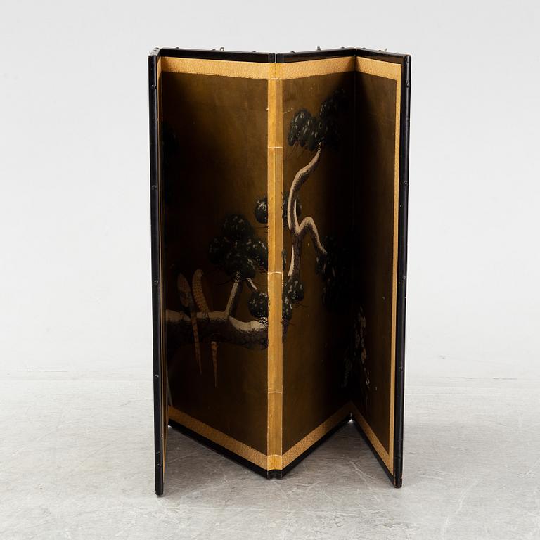 A Japanese four fold screen, 20th Century. Signed.