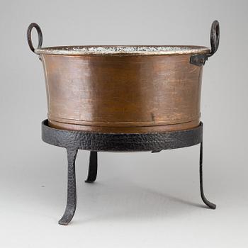 A 19th century copper cauldron.