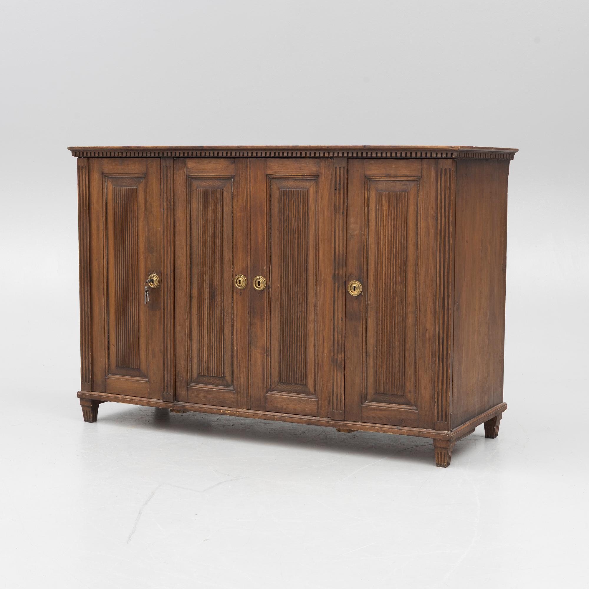 A Gustavian pine cupboard, late 18th century.