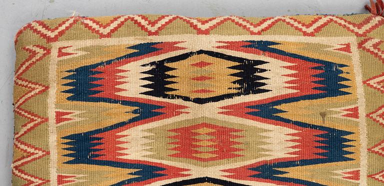 A carriage cushion, double-interlocked tapestry, ca 81 x 50 cm, Scania, mid 19th century.