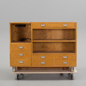 KÖPMANNADISK, 1900-talets mitt.