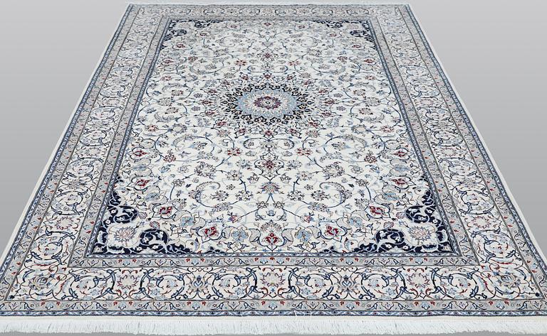 A Nain carpet, part silk, so called 6LAA, approximately 279 x 200 cm.