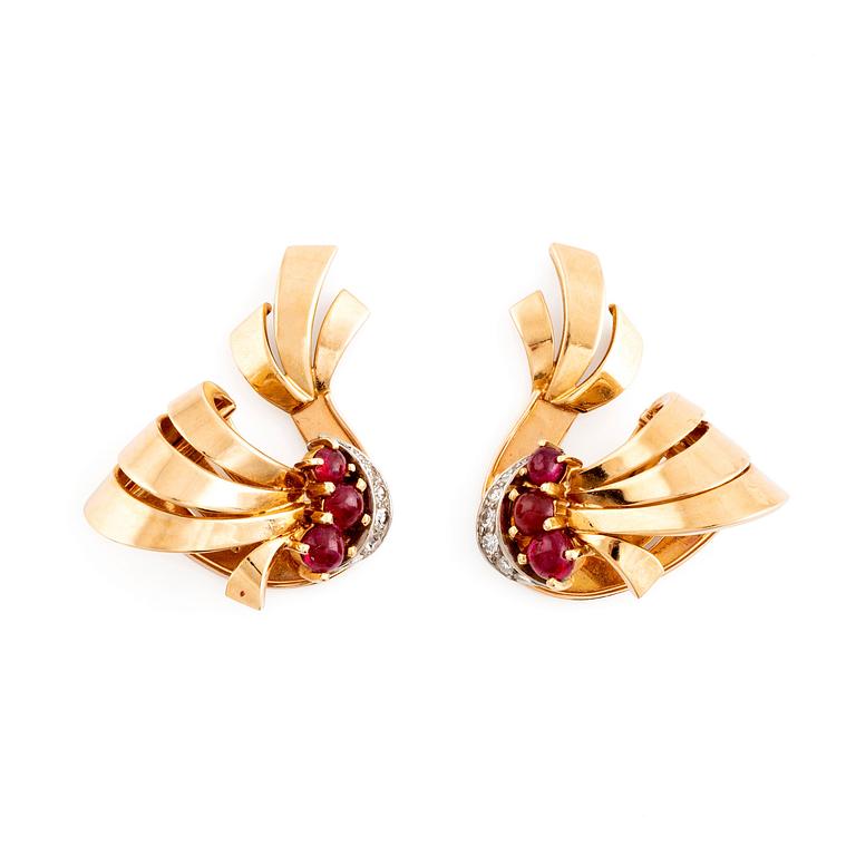 A pair of 18K gold WA Bolin earrings set with cabochon-cut rubies and eight-cut diamonds.