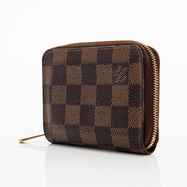 Louis Vuitton, a 'Zippy Coin Purse' wallet and an 'Inventeur' belt.