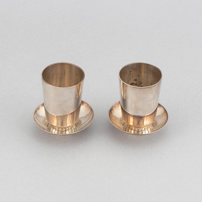 Sigvard Bernadotte, two beakers and two ashtrays, Copenhagen 1945-77, sterling silver, design nr 825A and 825.