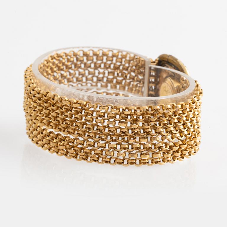Armband 18K guld med pärlor, med hårgömma.