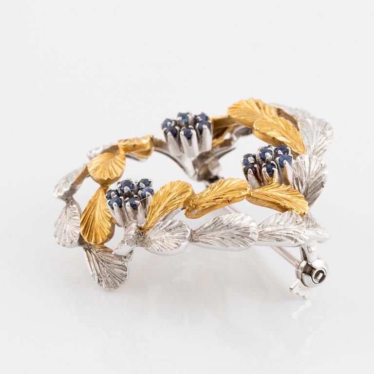 Brosch, krans 18K tvåfärgat guld och safirer.