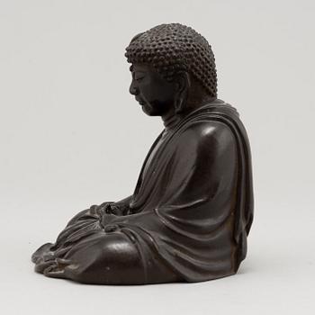 A Japanese seated bronze okimono of Amitabha buddha, 20th century.
