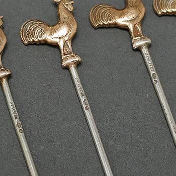 Twelve cocktail sticks in silver, made by Ge-Kå-Smyckek G Kaplan in Stockholm 1949. Weight 45 g.