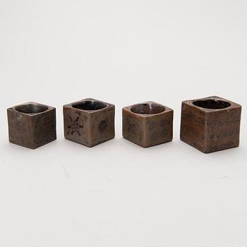 Four stoneware cruets, signed Bryk.