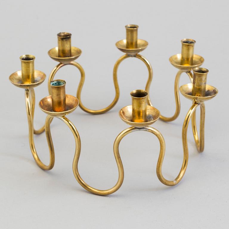 A Lars Holmström brass candle holder for seven candles, Svenskt Tenn, second half of the 20th century.