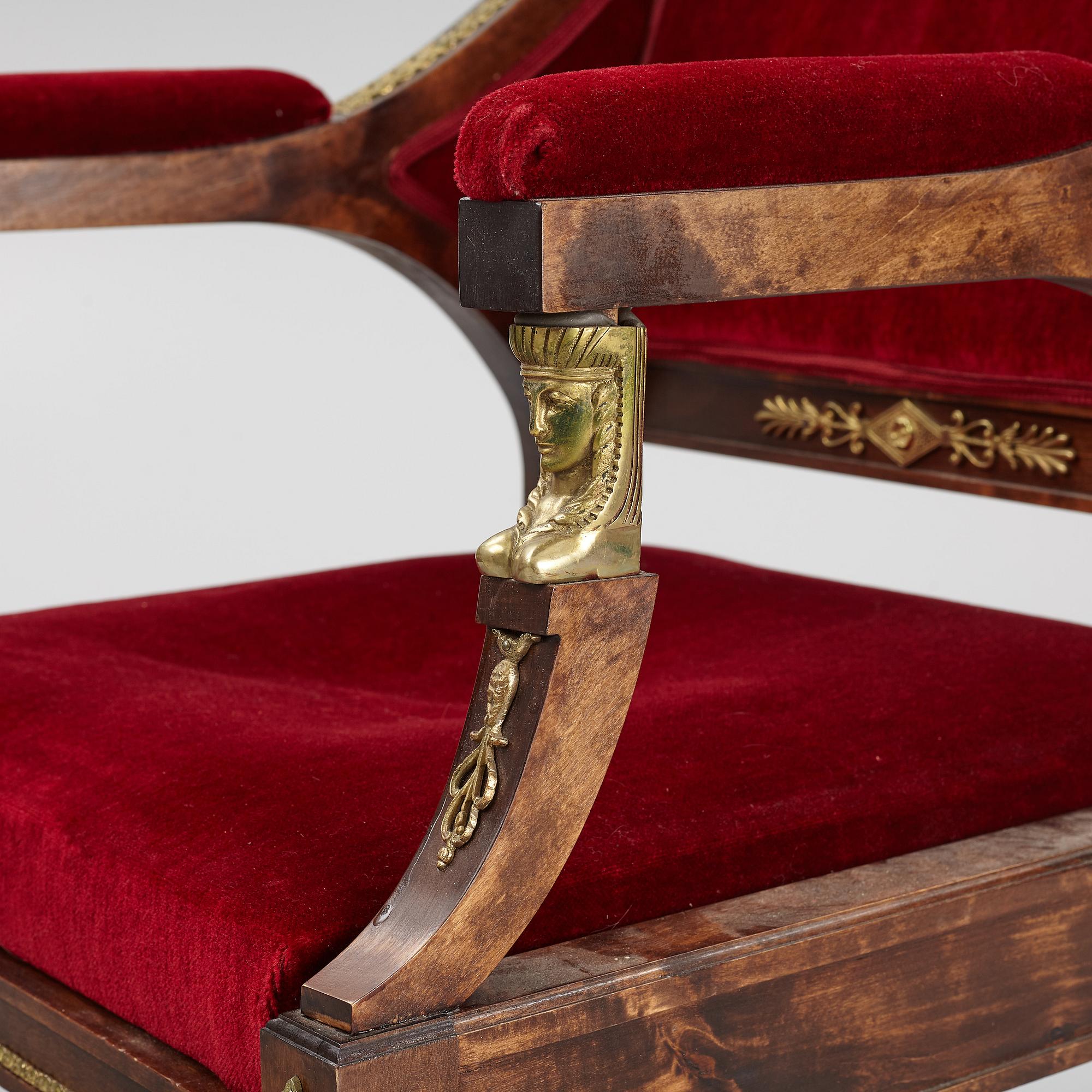 A pair of Empire style armchairs, first half of the 20th century.