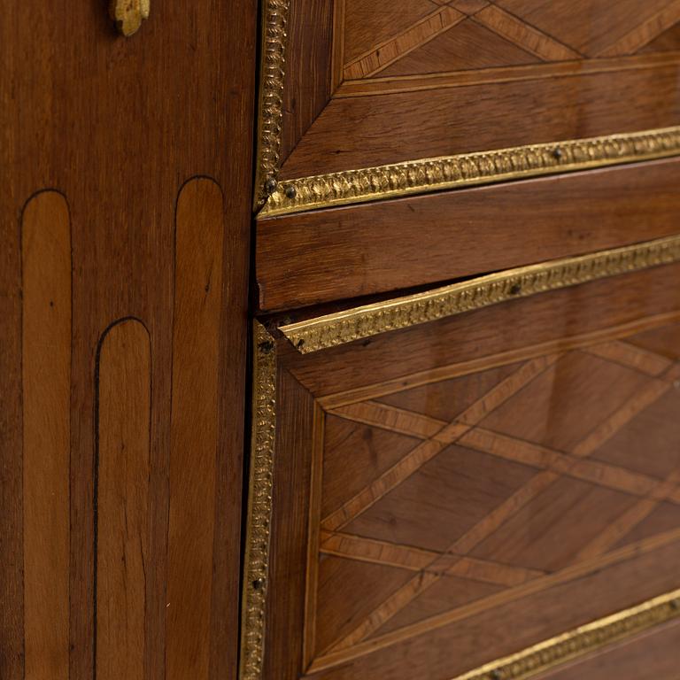 A Louis XVI-style chest of drawers, circa 1900.